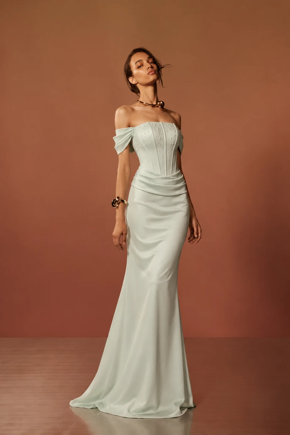 Soléne — an off-the-shoulder, draped couture design